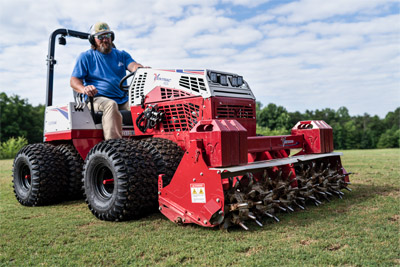 Aera-Vator tines engaging turf