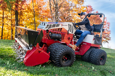 Ventrac Aera-Vator working turf with autumn backdrop